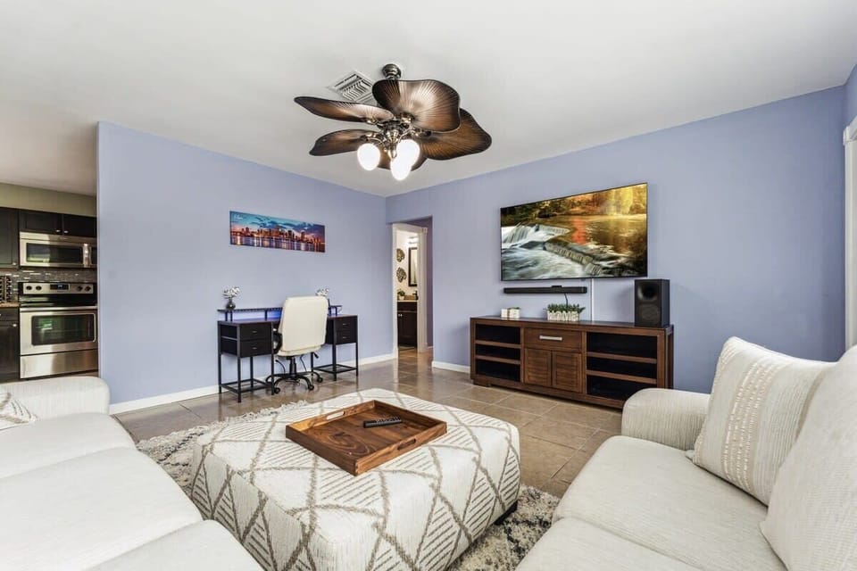 Experience the ultimate blend of comfort and sophistication in our Deerfield property's stylish living room. Your relaxation oasis awaits! Experience a great movie night with our 65in TV with great sound system to match! 