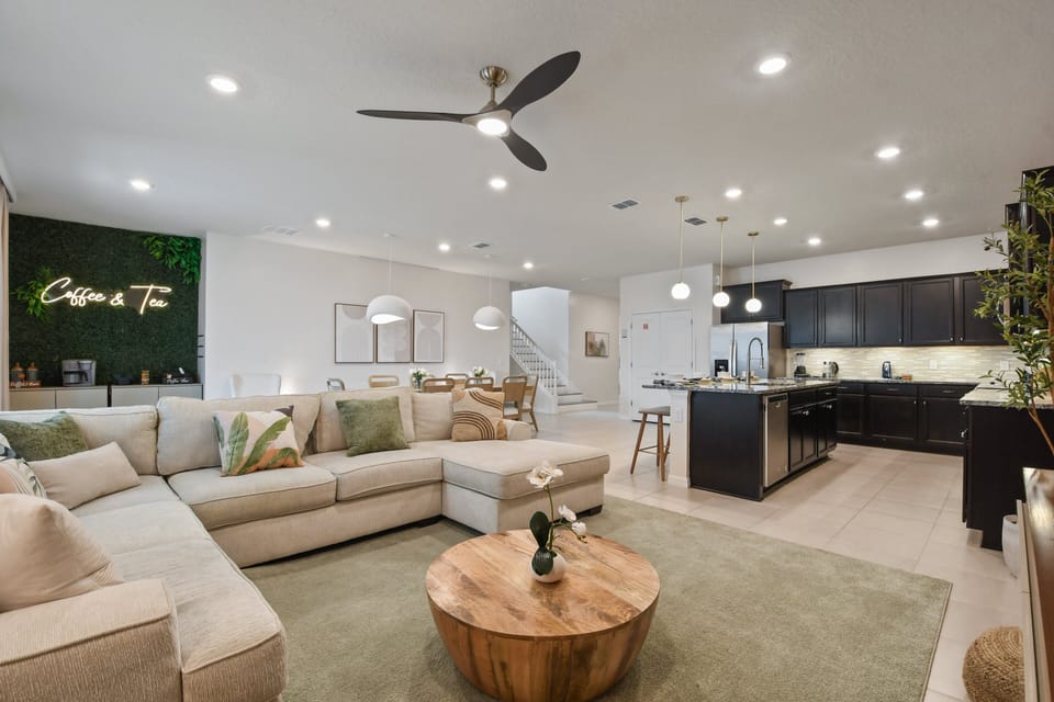 Spacious open floor plan with a cozy sectional, gourmet kitchen, and coffee bar!