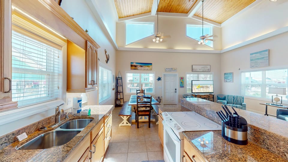 Adjacent to the kitchen, you'll find a charming dining area that comfortably seats ten, creating the perfect setting for memorable family meals.
