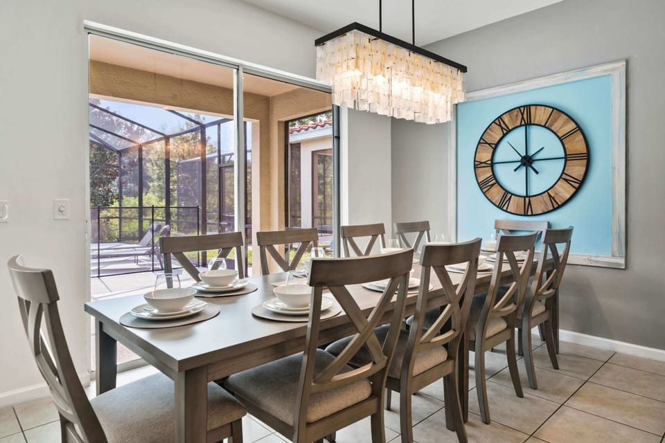 - Dining space with stylish setup and easy access to pool patio  
- Large table seats families comfortably for vacation meals together  
- Perfect Orlando rental feature for group dinners and celebrations