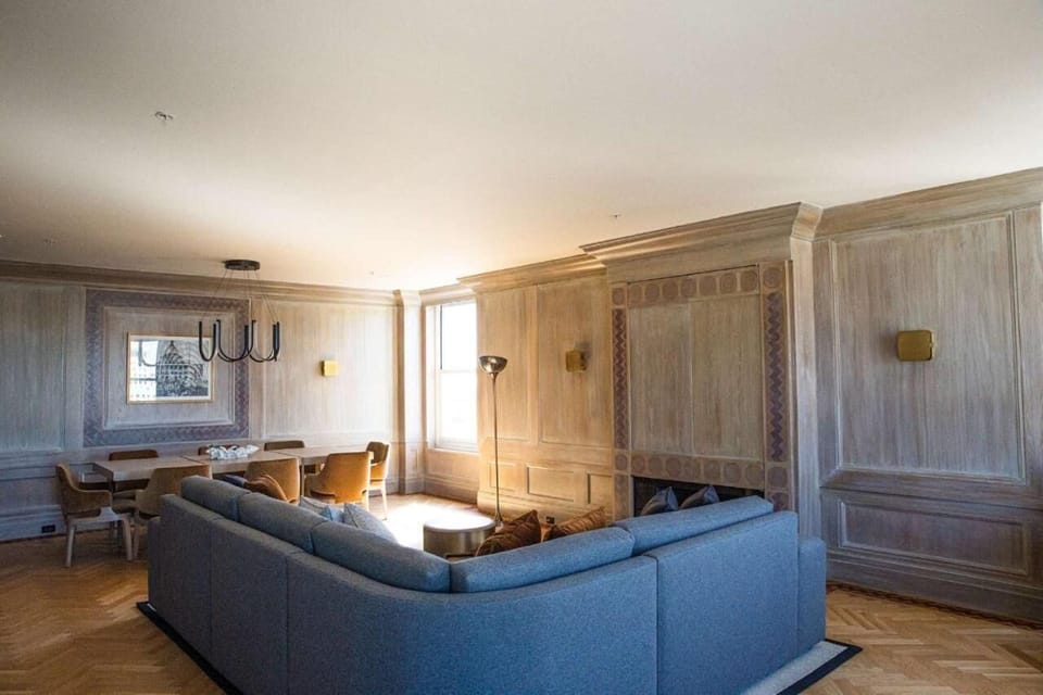 Stretch out in a spacious living area with warm wood tones.