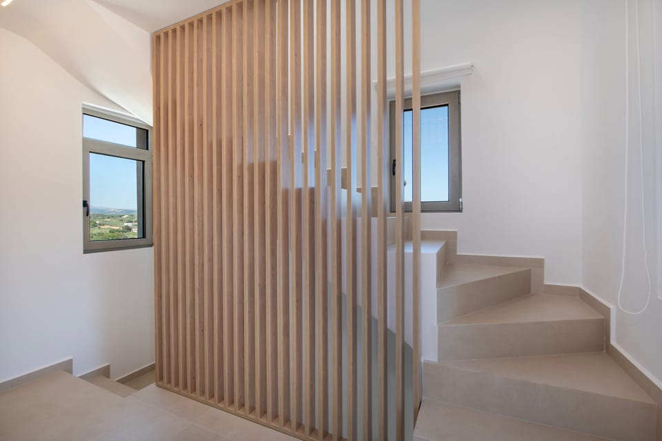 Stairs leading to the attic-type bedroom.