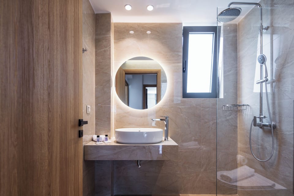 Ground floor shared bathroom featuring  shower cabin.