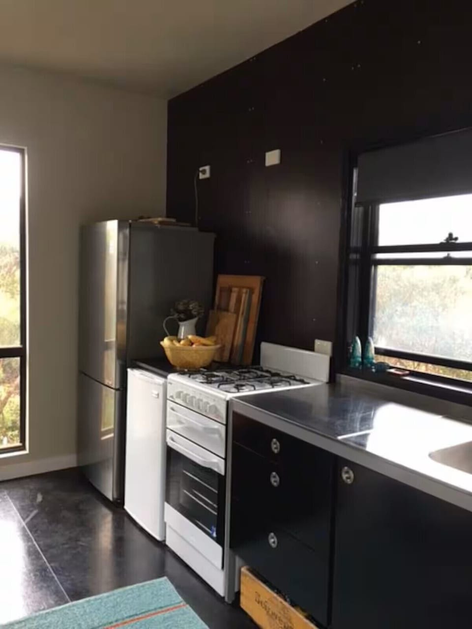 simple kitchen,  fridge, sink, fry pans, toasty maker, rice cooker, knives etc