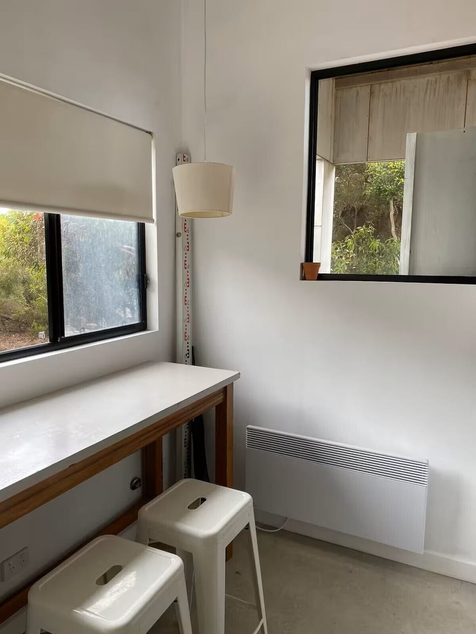 high bench for reading and drawing. views to kitchen and deck