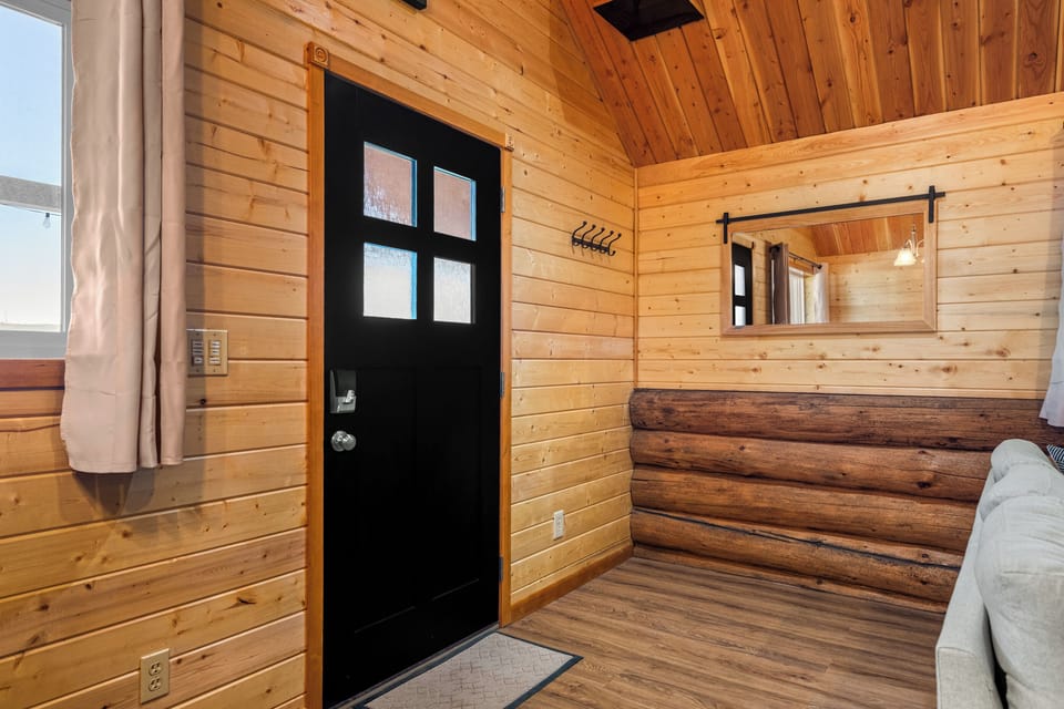 Entrance with hangars for coats and hats. 