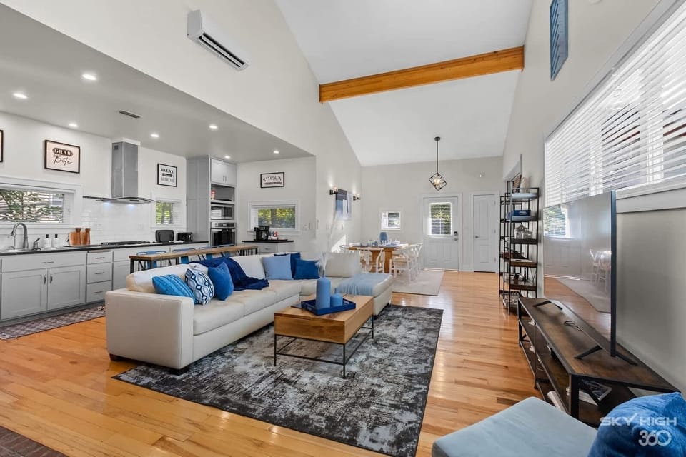 Living room stocked with board games and a Smart TV