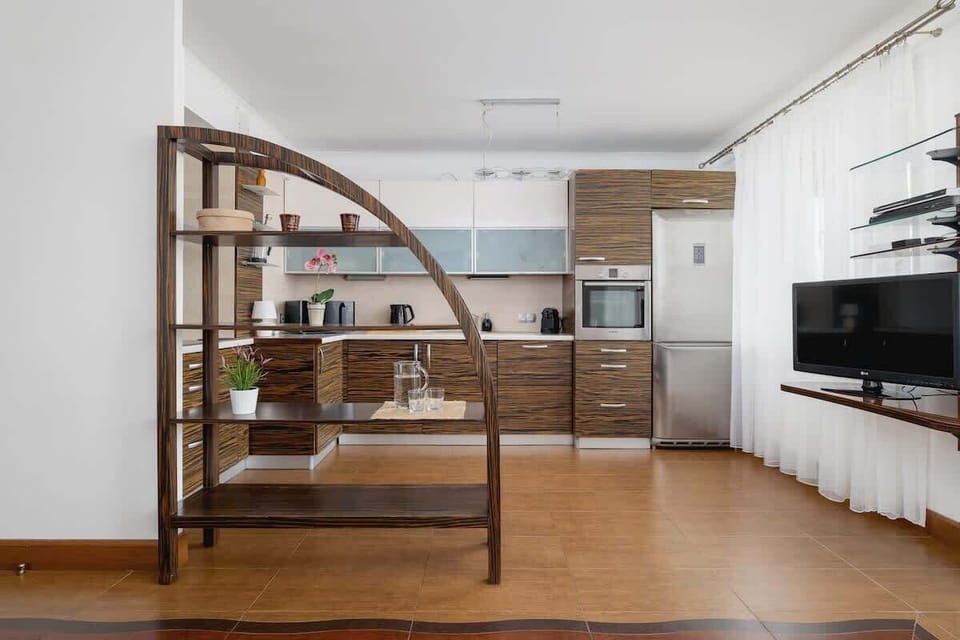 A perspective showing the open connection between kitchen and living space.