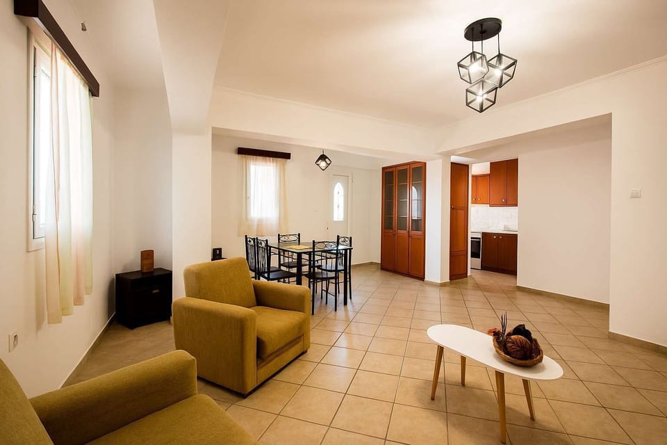 Bright and Cozy Living Area with Open Access to Dining Room


