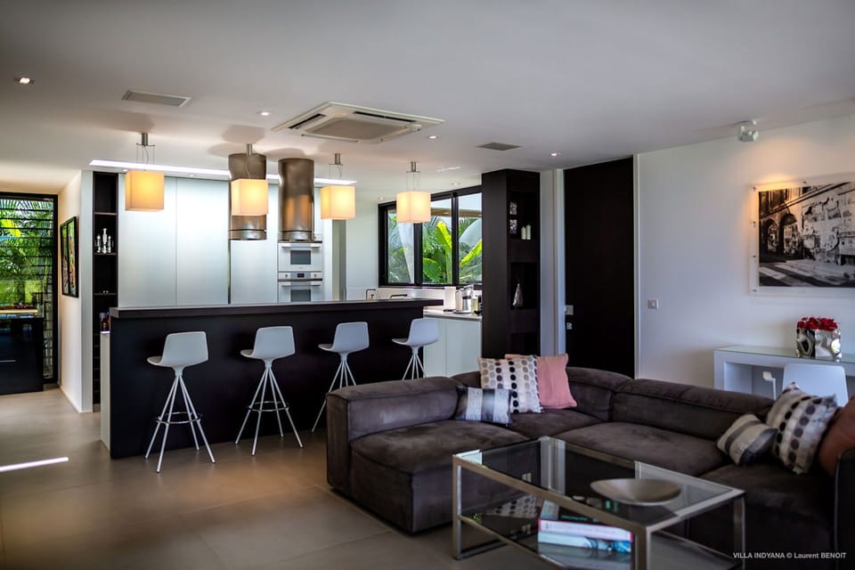 Air-conditioning, large HD-TV with Dish Network, Apple TV, iPod dock. The living room opens onto the terrace. 