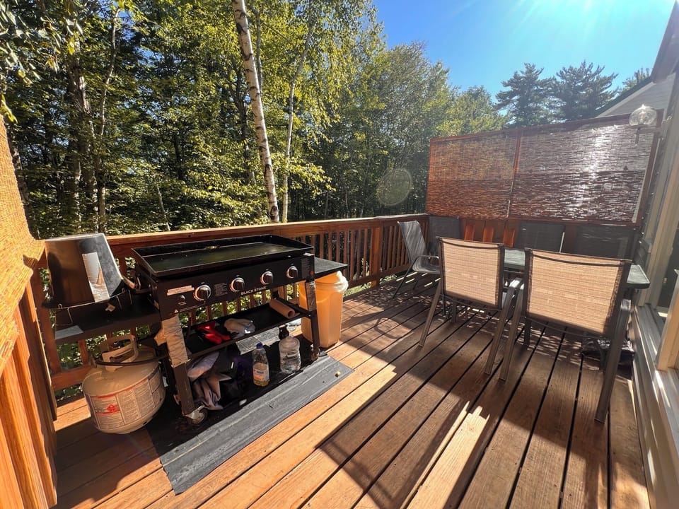 Private deck with grill and dining—great for coffee or BBQs.