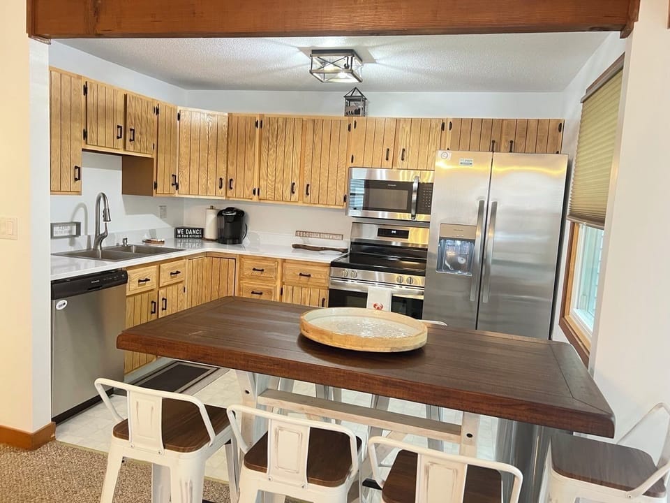 Full kitchen with stainless appliances and dining for the family.
