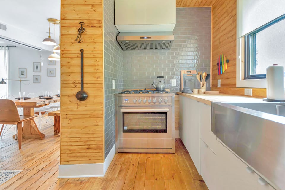 Spacious kitchen with stainless steel appliances. 