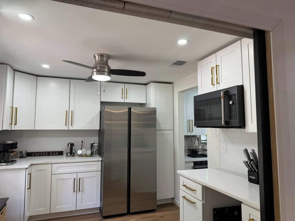 Extended kitchen with Full fridge that has an ice maker and supplies filtered water. Plenty of space to prep your meals