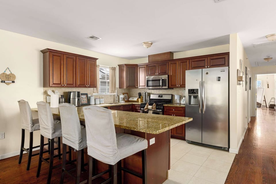 Newark Pearl Level 3 Kitchen + Hallway leading to bedrooms and bathrooms