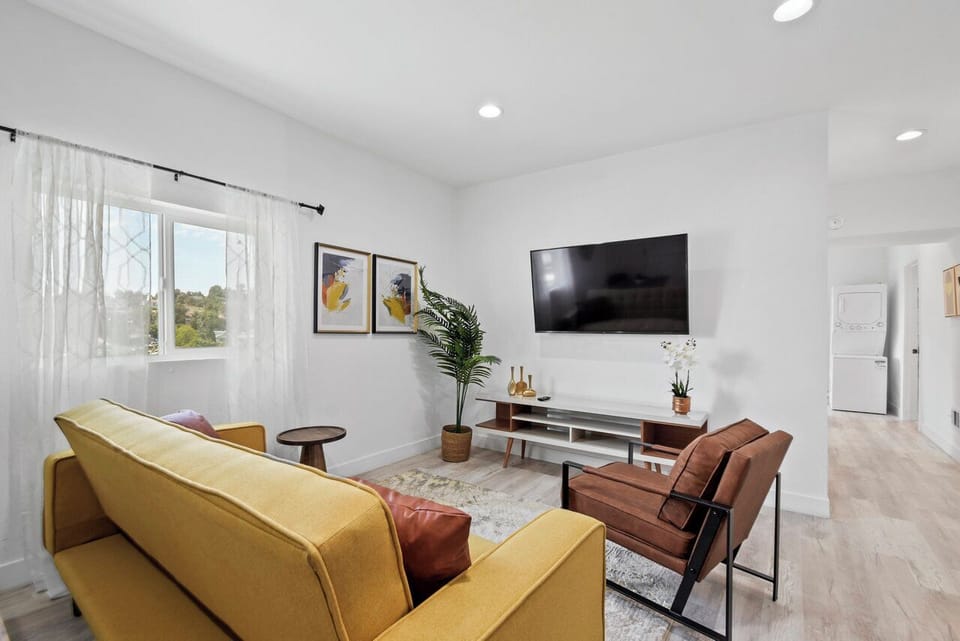 Comfortable living room with ample seating and smart TV.