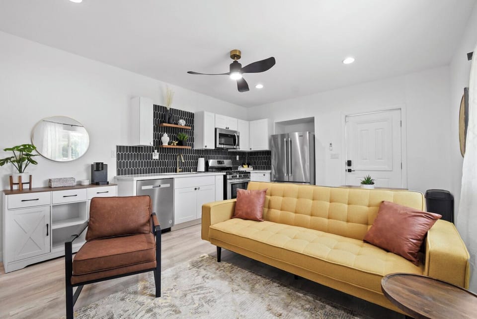 Comfortable living room with plenty of seating and a smart TV.