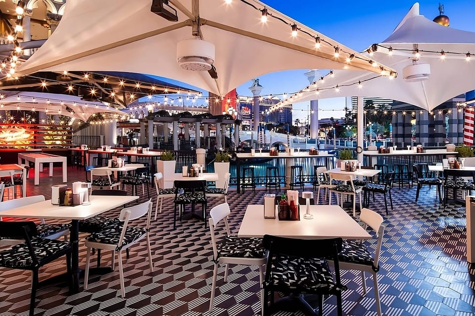 Sip cocktails under twinkle lights in lively open-air seating.