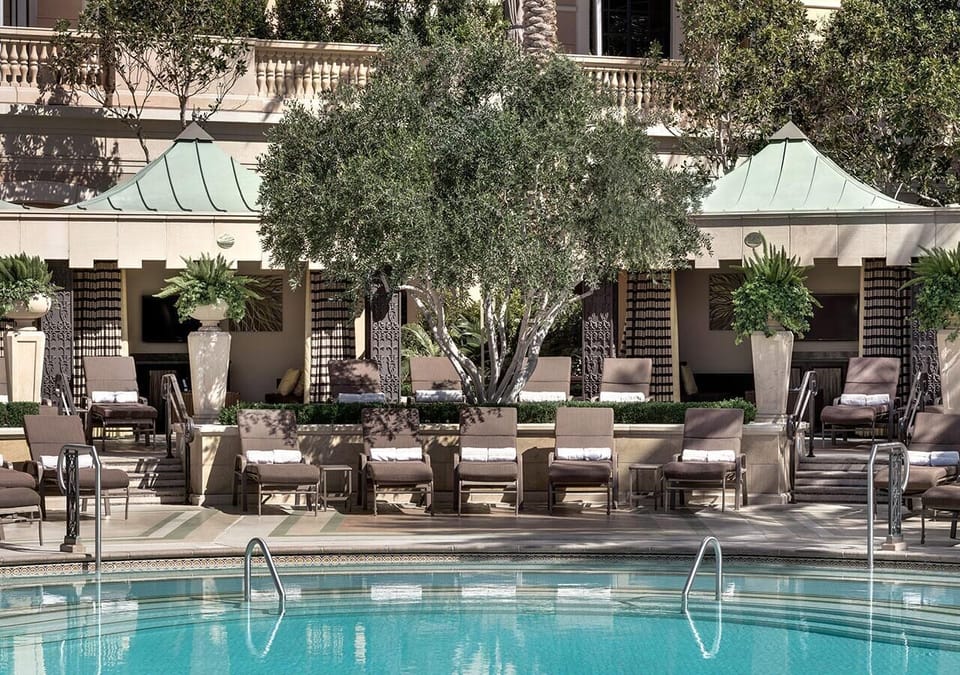 Unwind poolside beneath shaded cabanas and sparkling blue water.