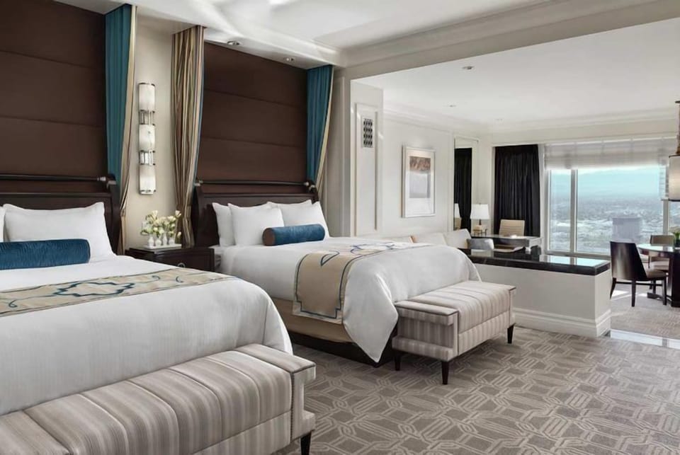 Enjoy roomy double beds framed by a sunlit window wall.