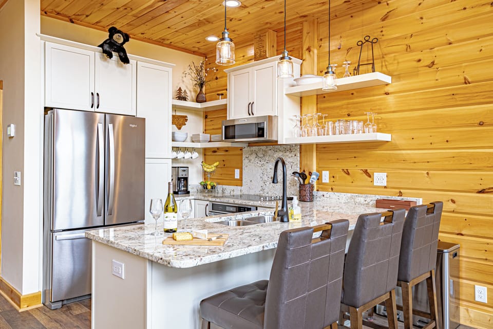 All new KitchenAid appliances (Whirlpool fridge).   Smooth-surface stovetop.