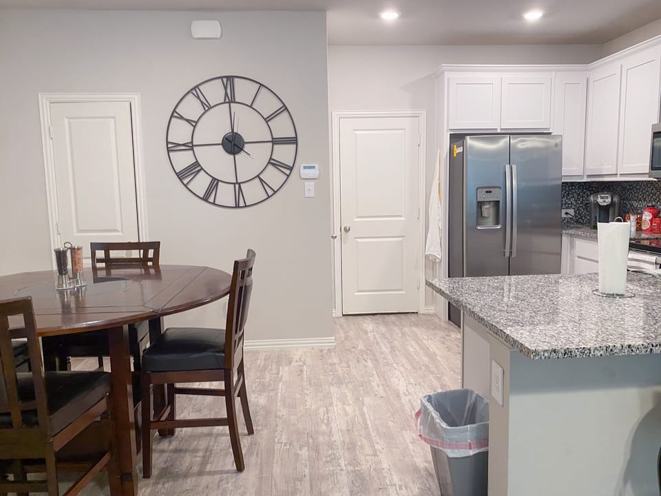 dining table, garage door and kitchen