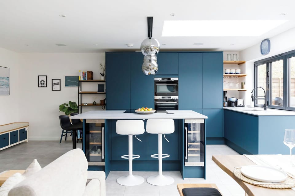 The dark coloured cabinetry makes this a gorgeous statement kitchen.
