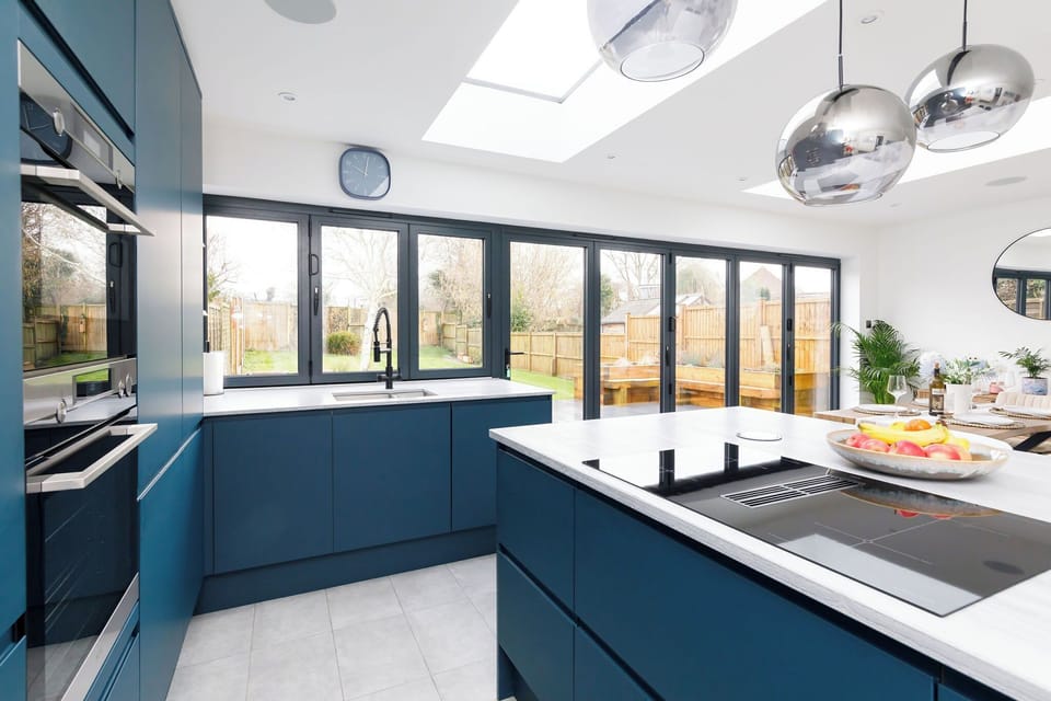 The modern kitchen is fully equipped with state-of-the-art appliances, spacious countertops and ample cabinetry for preparing and cooking.