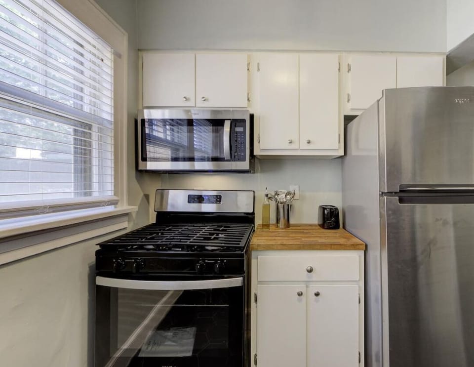 A well-stocked kitchen with everything you need to whip up a delicious meal, plus a bright and airy vibe to start your day right.
