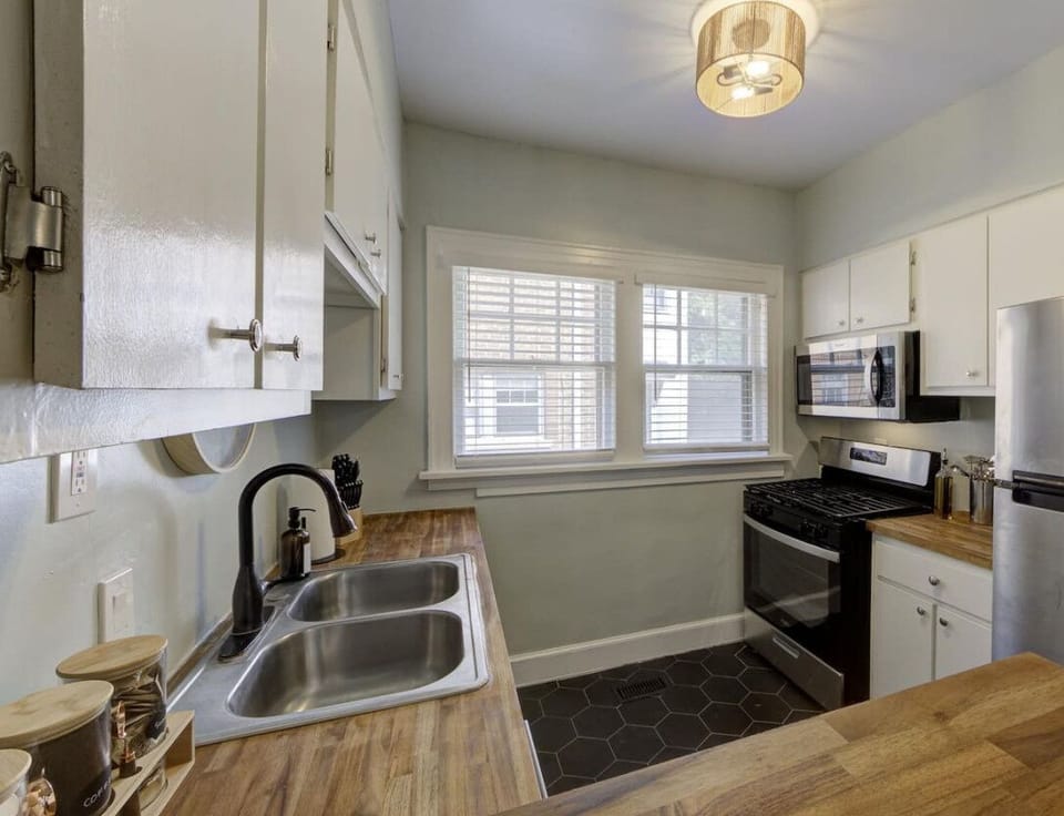Cook up your favorite meals in this fully equipped kitchen, featuring modern appliances and plenty of natural light.