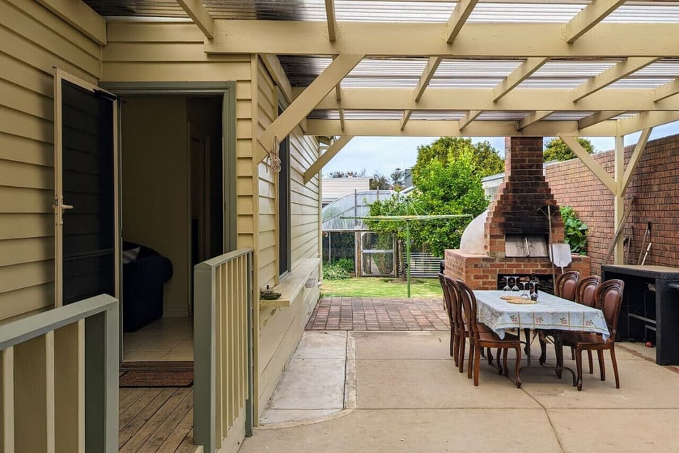Guesthouse entrance & shared patio / backyard