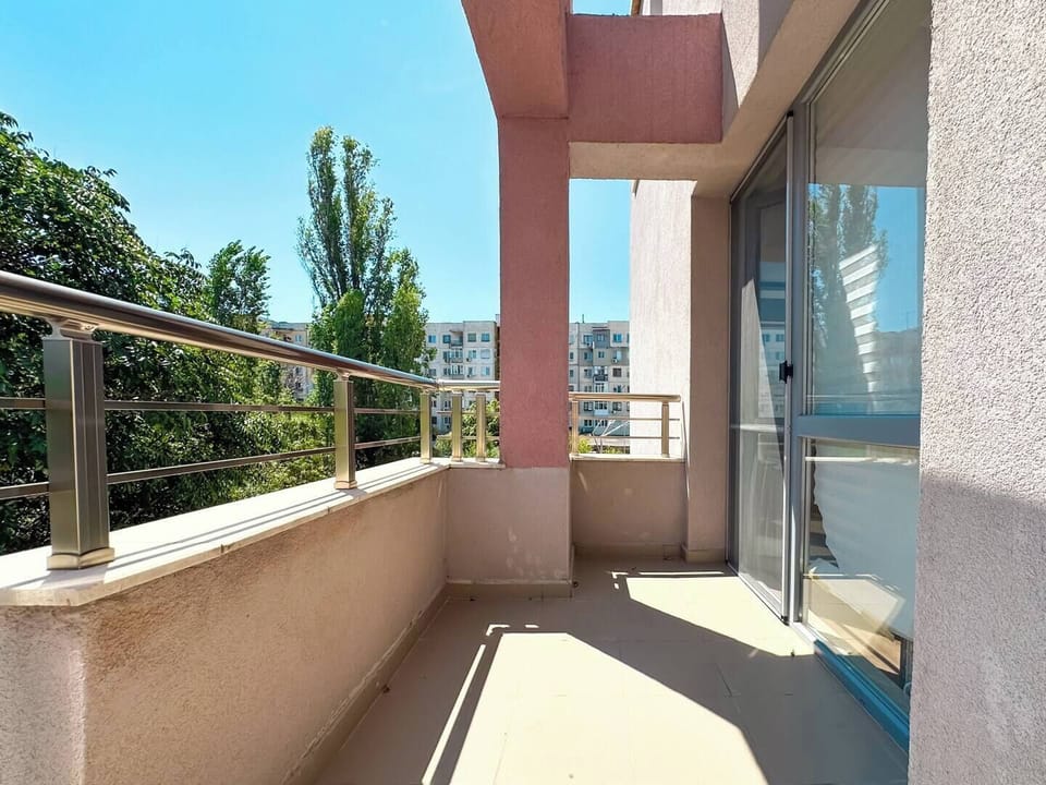 Step out onto your private balcony and soak in the sunshine with views of lush greenery and the surrounding neighborhood. This outdoor space is perfect for enjoying your morning coffee or unwinding after a day of exploring the city.