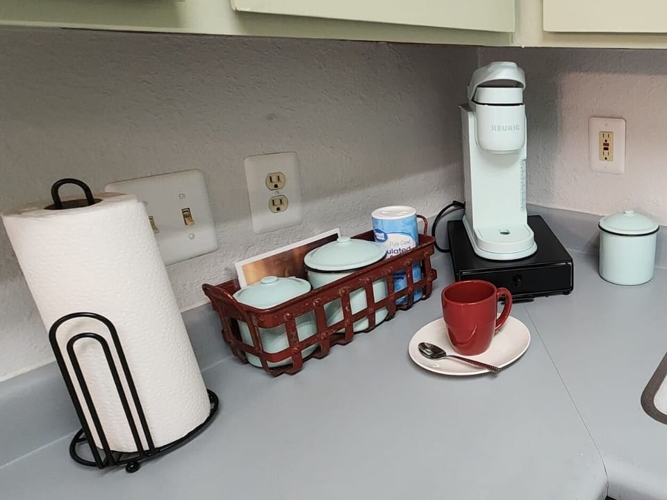 We provide a single cup Keurig coffee maker and starter coffee.