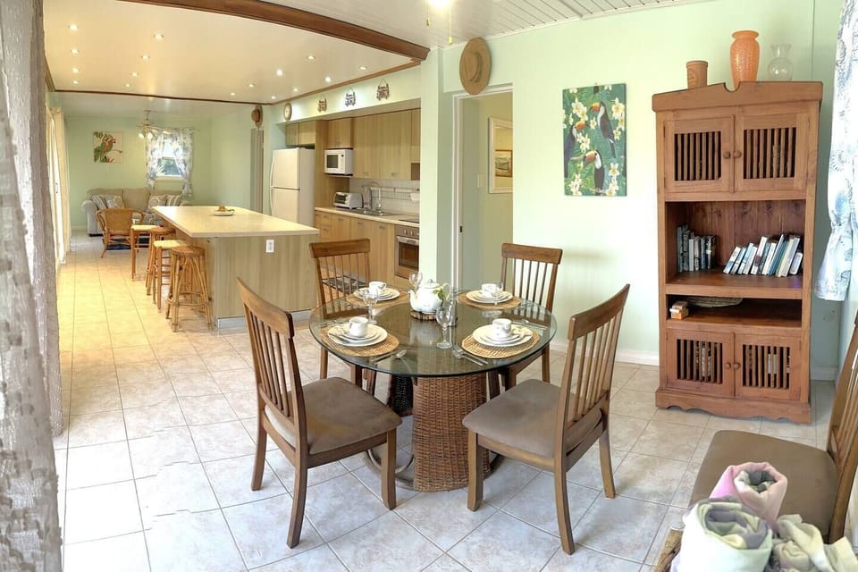 The dining room set has 6 chairs. The large island has 4 stools.
