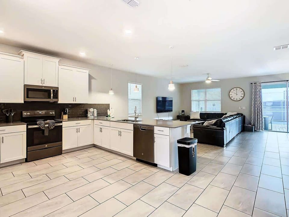 Keeping friends and family together in a large space leading out to the covered patio with pool and spa