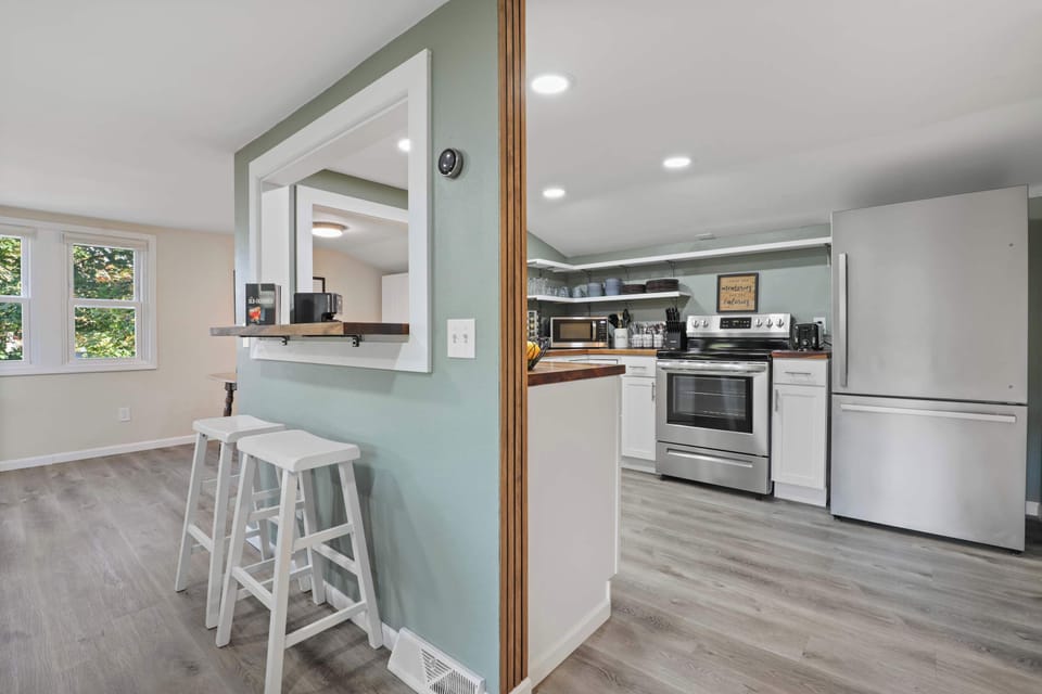 Barstool seating off the kitchen breakfast bar