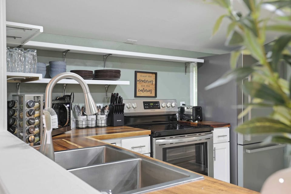 Fully stocked kitchen with drip coffee maker, blender, pots, pans, seasonings, etc. All your kitchen needs are here. 