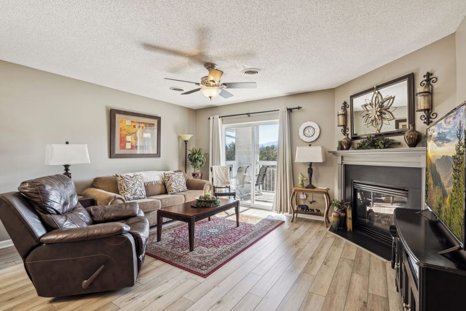 Spacious Living Room with Gas Fireplace, Sleeper Sofa and SMART TV with Cable & WIFI throughout vacation rental