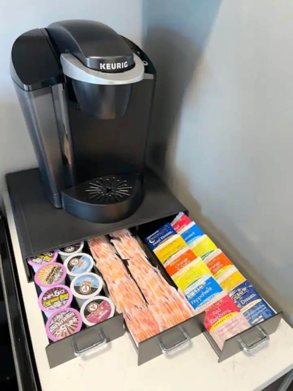Keurig machine with coffee pods, sugar, creamer and teas included. 
