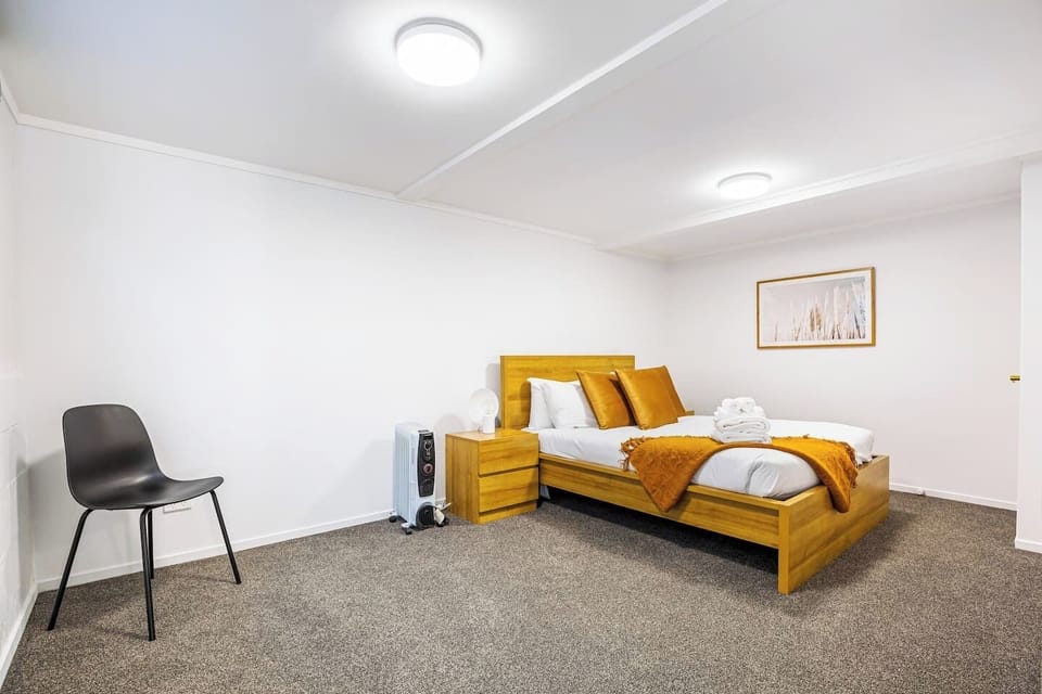 The bedroom is calm and welcoming with its neutral colour pallette.