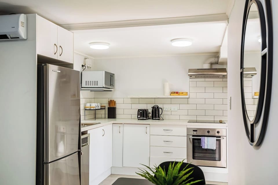 The kitchen is part of the open-plan living spaces with the dining and living rooms.