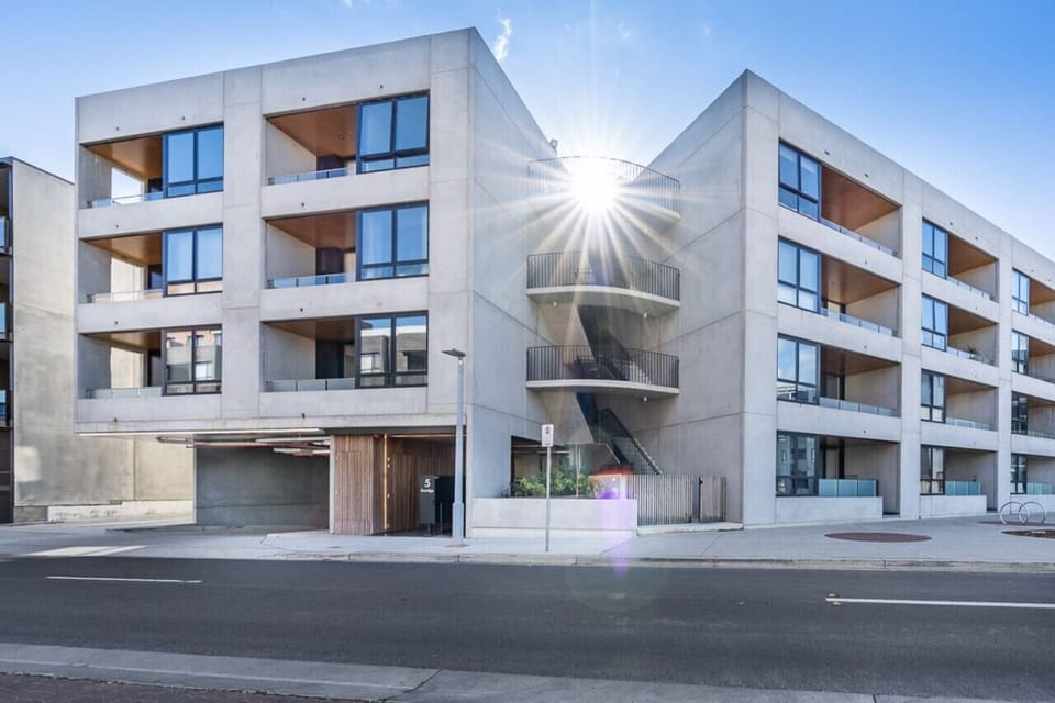 Sleek, modern building with a contemporary exterior, offering a stylish and impressive first impression. Clean lines and elegant design make this property stand out in the neighborhood.