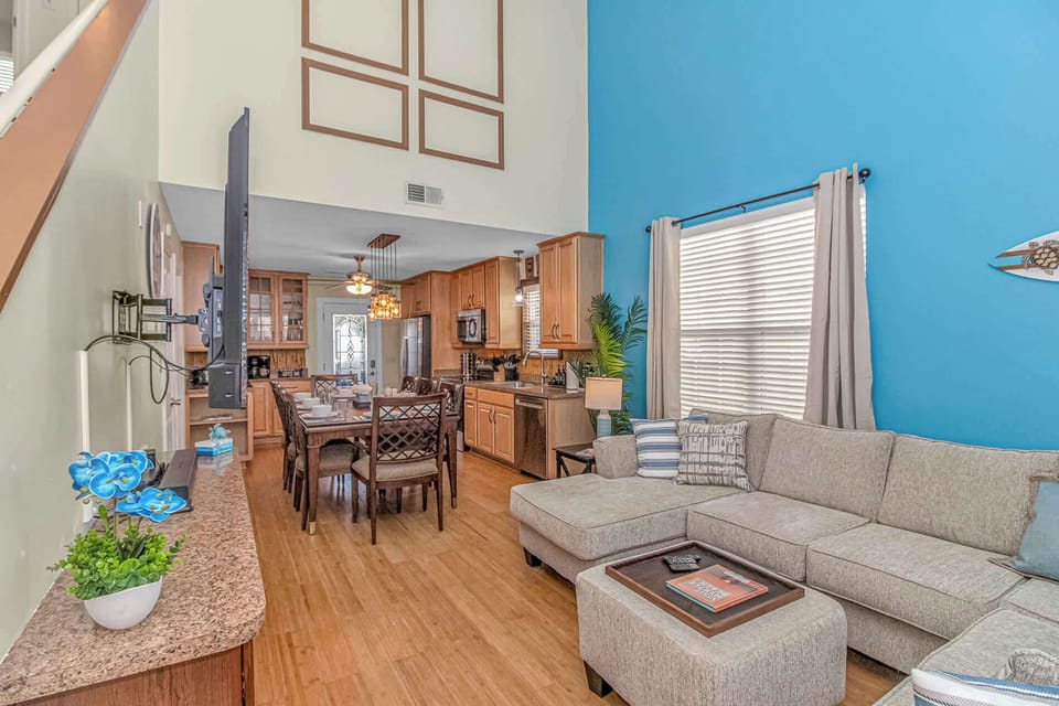 Seamless style and open space — where the living room, dining area, and kitchen come together for effortless living and entertaining. 