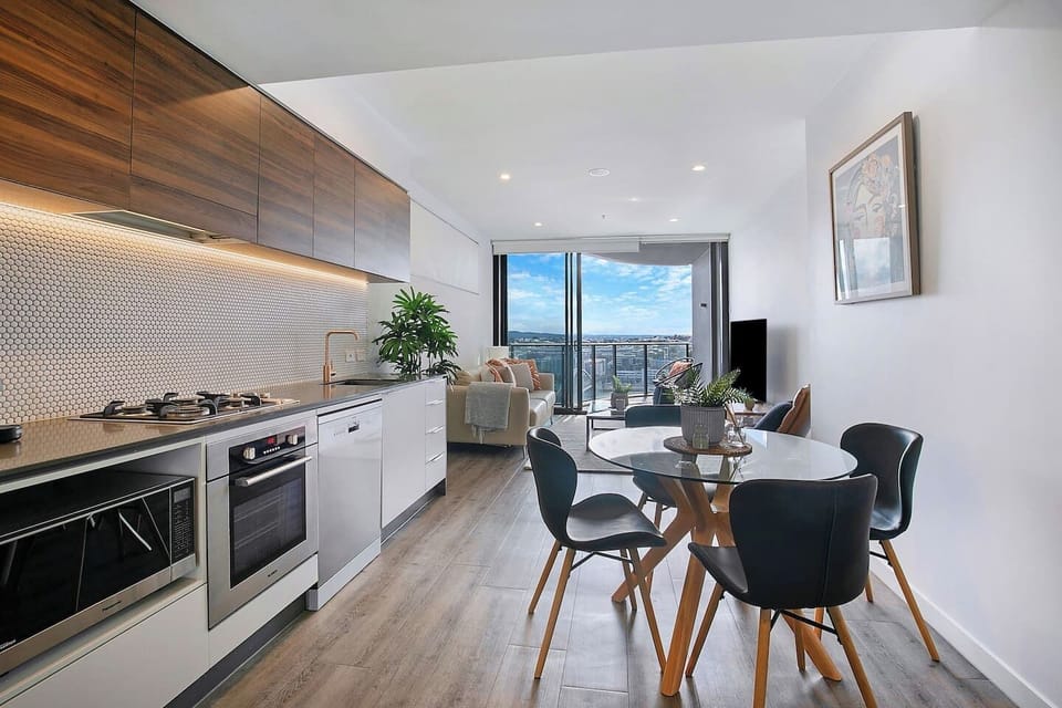 An open, light-filled layout includes a four-seater table to share meals around when you’re not dining out. 

