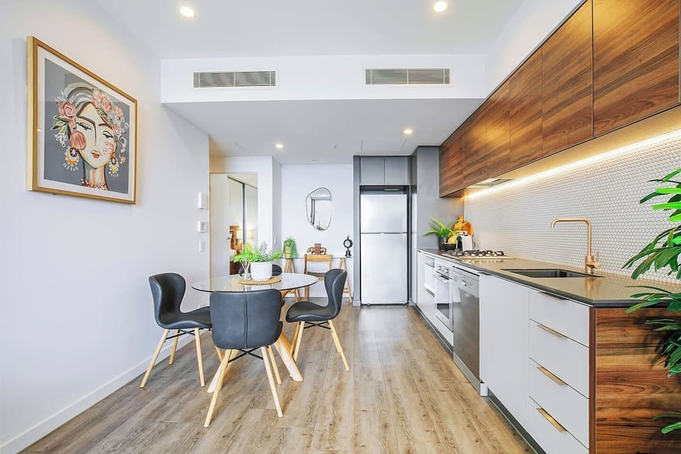  A modern, streamlined kitchen offers all you need to prepare meals, plus a dishwasher for easy clean-up. 
