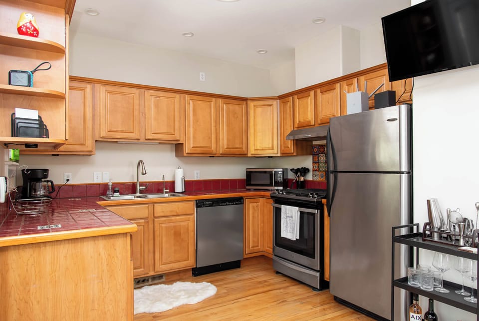 Fully stocked kitchen with stainless steel appliances