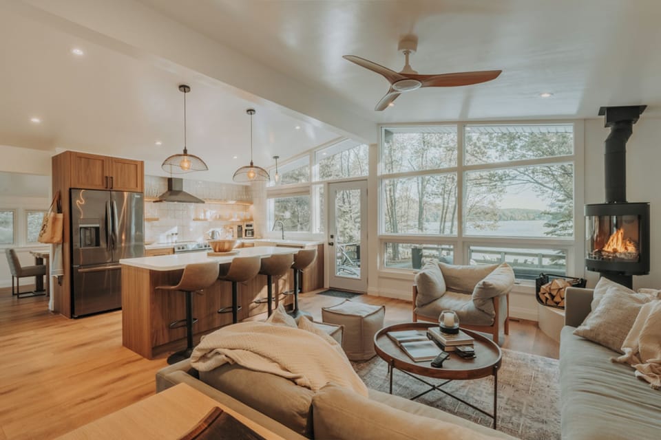 Kitchen & Living Room w/ fireplace overlooking the lake