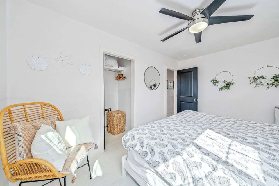 The second of two comfortable bedrooms offers a queen bed & ceiling fan