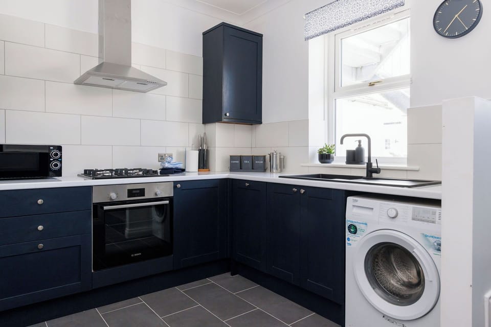 Enjoy preparing meals in the fully equipped kitchen. There is also a washing machine to keep on top of holiday laundry!