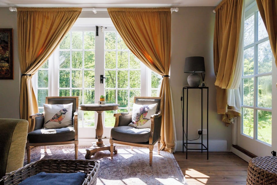 Charming seating area with garden views, perfect for a peaceful morning coffee